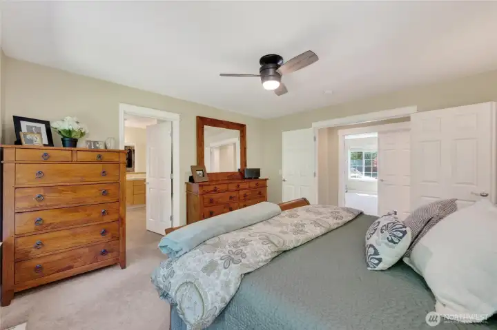 French doors off upper hall lead to spacious primary suite.