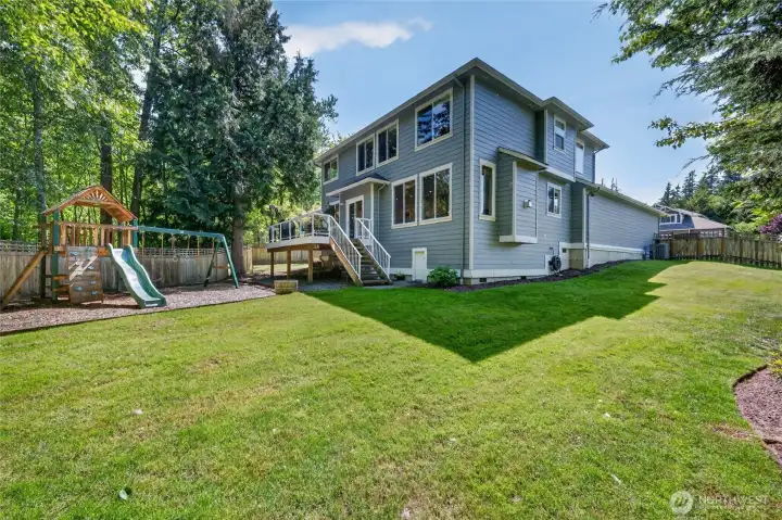 View of back yard.  Door of steps leads to great full height, dry extra storage space. Home has recently been freshly painted.