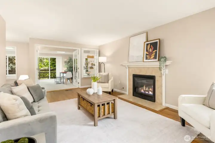 Enter the spacious living room with large windows and Propane fireplace.