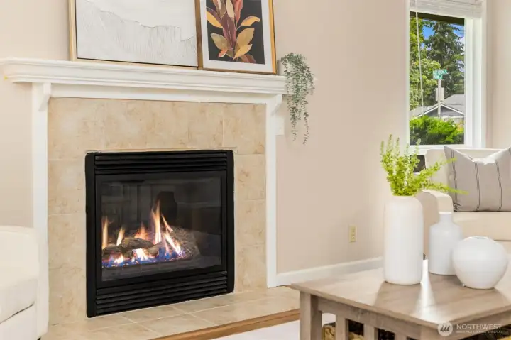 The living room has a cozy fireplace and the benefit of a cozy gas fireplace. As an end unit location the home has abundant large windows letting in great light.
