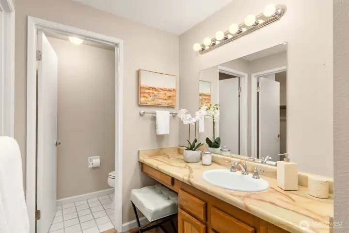 The primary bath with private toilet area.