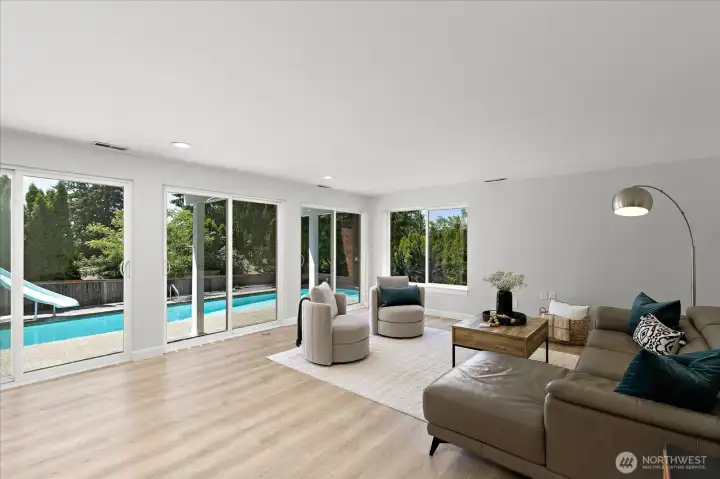 Downstairs living room/rec room with pool view Downstairs living room/rec room with pool view