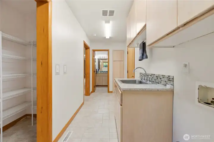 Utility Room with walk in pantry and 1/2 bath
