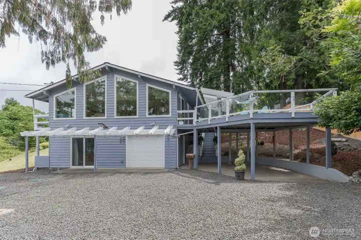 Incredibly large windows, pergolas, a huge deck and so much more await you Incredibly large windows, pergolas, a huge deck and so much more await you