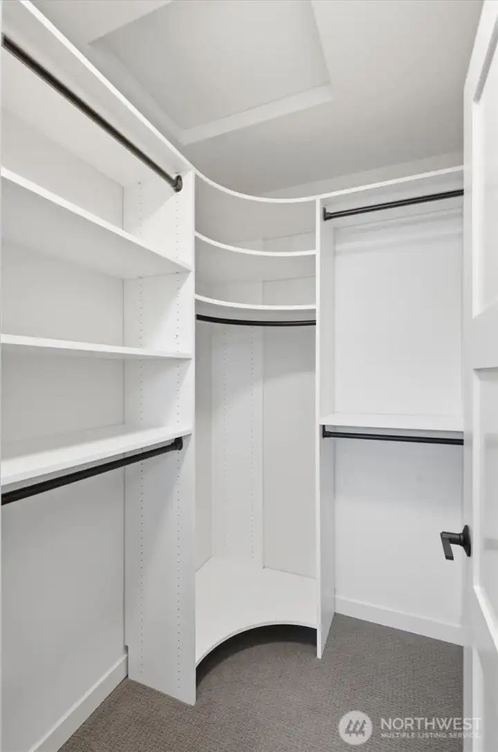 Primary walk-in closet Primary walk-in closet