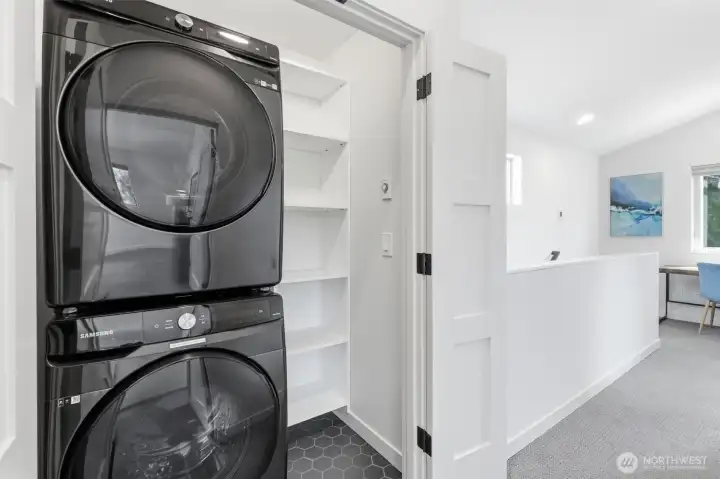 Upper level laundry closet with full sized washer/dryer Upper level laundry closet with full sized washer/dryer