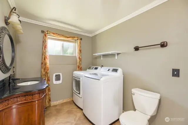 A thoughtfully done 3/4 bath with brand new washer and dryer