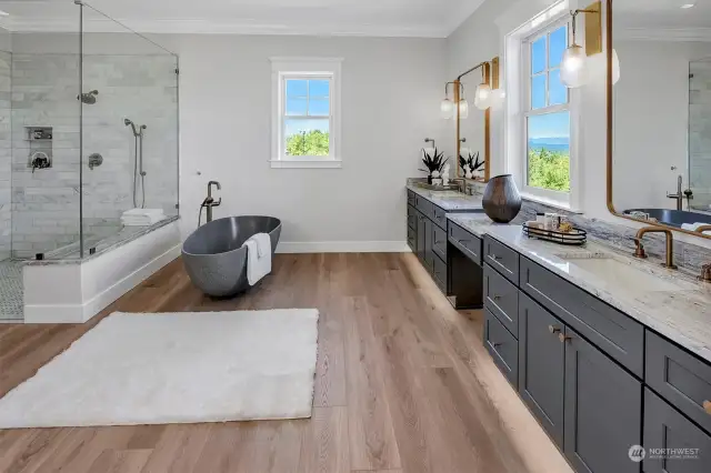 Primary bathroom with granite counters, marble shower,soaking tub and limestone flooring!