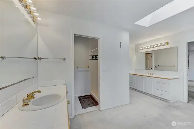 Primary Bath w/separate vanities & basins; toilet & shower behind door (center)