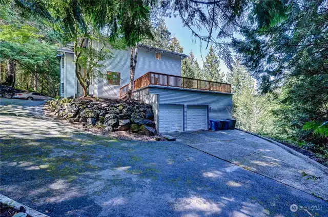 Garage approach; camera lens distorts slope; pad is virtually flat.