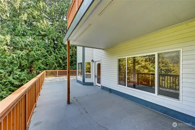 Deck looking east. Family room picture window (right).