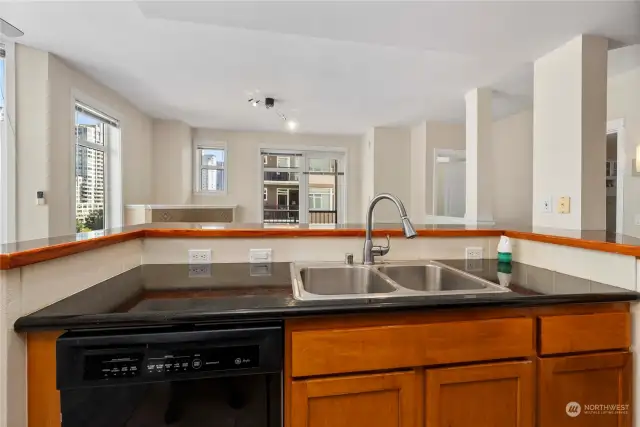 Open floor plan. Kitchen with multiple view angles and looking into the living room