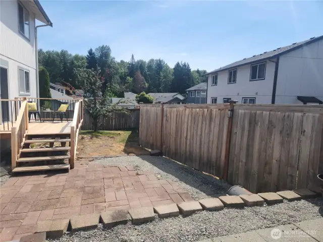 Backyard with deck off of kitchen, Paver patio. Spacious for entertaining