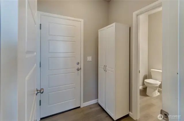Mud room off garage with pantry and 1/2 bath