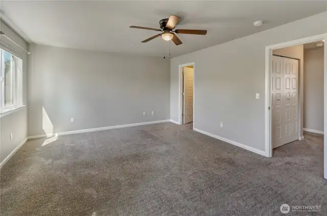 Primary bedroom with walk in closet