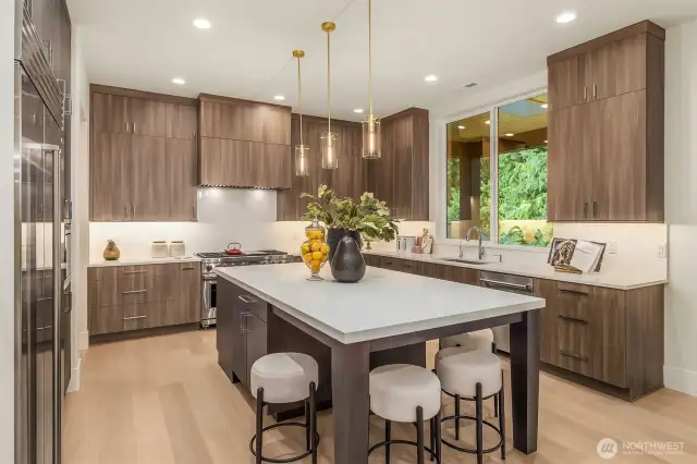 Striking full-slab backsplash seamlessly connected to the countertop pattern.