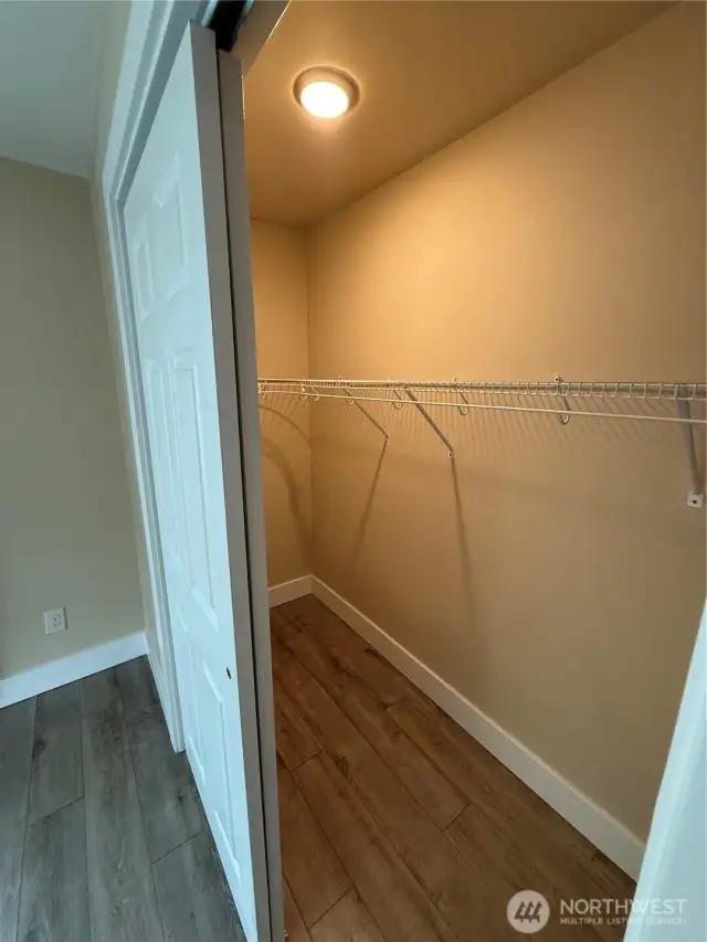 almost walkin closet with light.