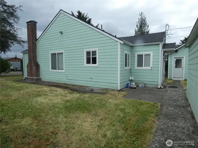Garage, shed and rear side of house.