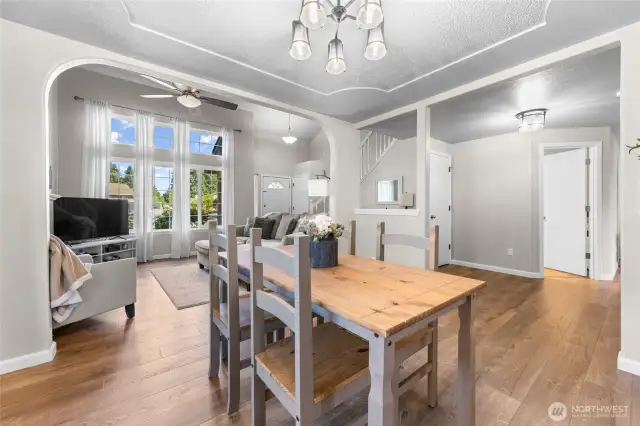 Dining opens to living and kitchen