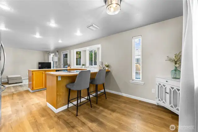 Spacious kitchen with sliding door to fully fenced backyard