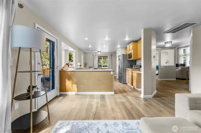 This kitchen opens to living area and steps out to fenced backyard