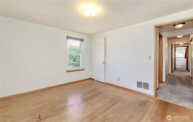 1st (forward) bedroom.  HW floor throughout home.