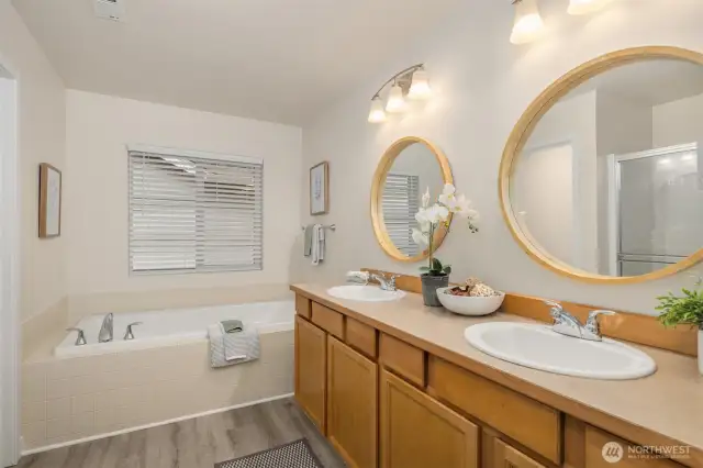 updated bath with double vanity in primary bedroom