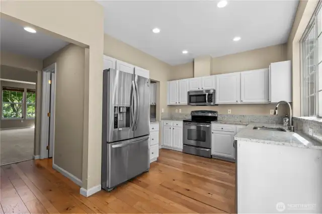 The well-appointed kitchen is a culinary delight, featuring modern appliances, generous counter space, and a coveted butler’s pantry to keep your essentials organized