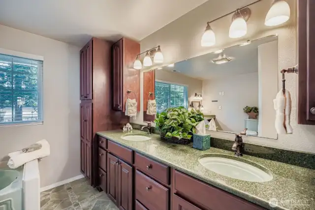 double sinks and lots of cabinets and drawers