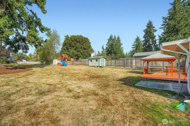 back yard goes clear to wood fence line in back