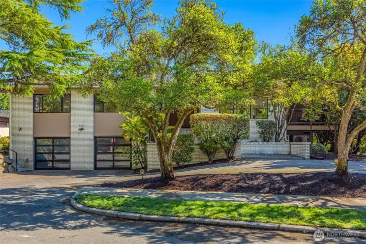 Welcome to 6667 NE Windermere Road with circular driveway and 2 car garage.