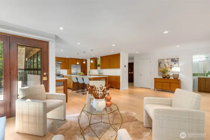 This shows the scale of the generous spaces and how they connnect to the powder room, entry and kitchen