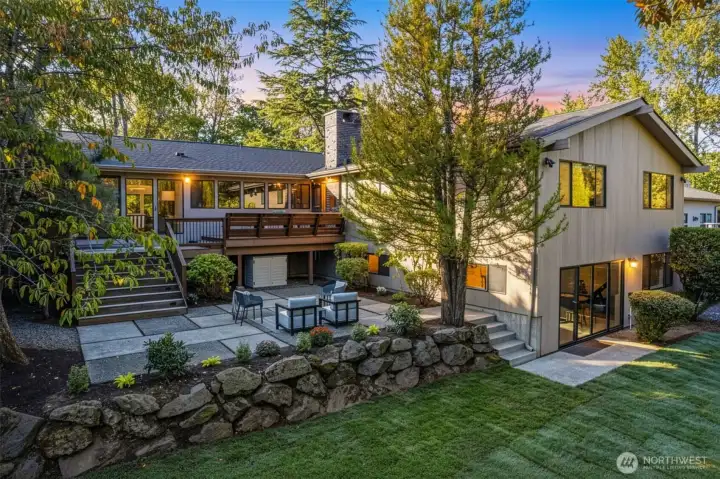 Versatile grounds with Ipe deck, lower patio and level grassy area with gardening space and privacy on a 11,700 sq foot lot