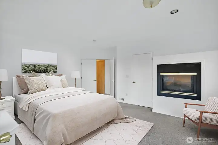 Spacious Primary Bedroom with fireplace.