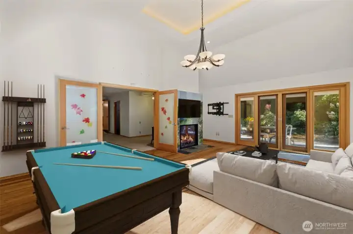 Virtually Staged- Family Room. French doors Lead to Private Outdoor Oasis.