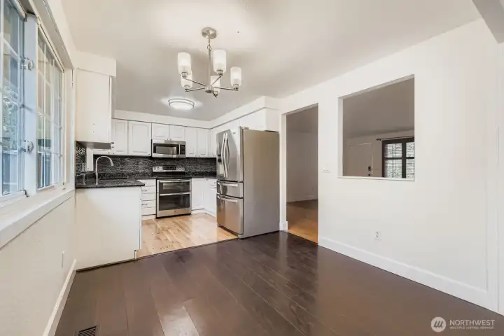Dining area off updated kitchen features engineered hardwoods and new lighting fixture. Space can accommodate up seating for up to 6.