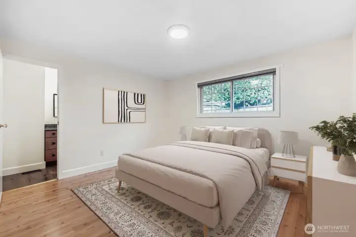 Virtually staged. Primary bedroom with adjacent full bath, large cloest, fresh paint, all new lighting and engineered hardwoods.