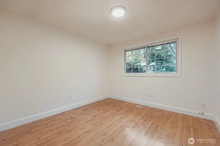 2nd bedroom with large closet, fresh paint, all new lighting and engineered hardwoods.
