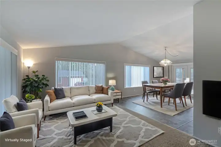 Open living room is light and bright with vaulted ceilings and large windows that provides lots of natural light.