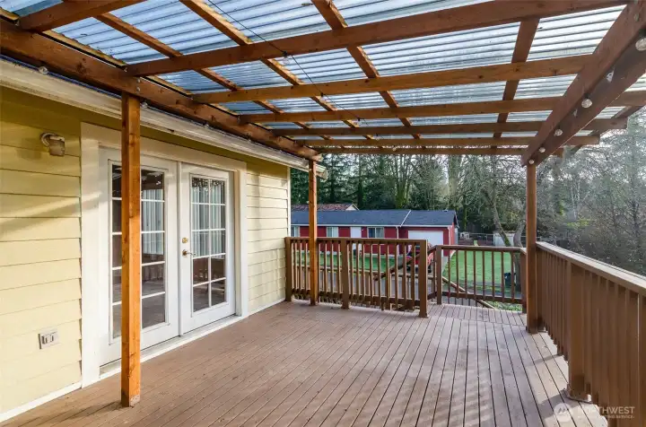 Another view of deck showing French doors that lead to dining area.
