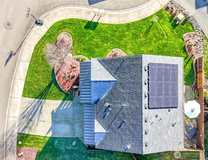 Roof of home showing 4 solar panels.