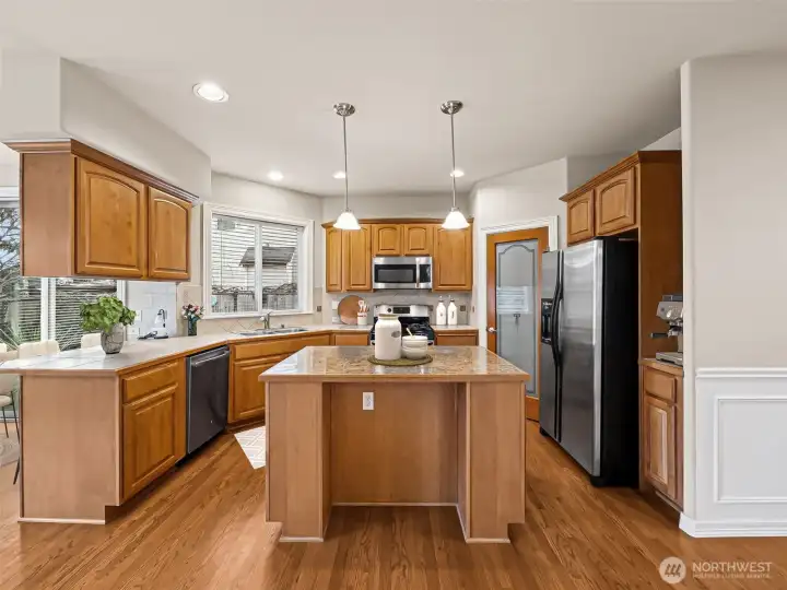 Kitchen open to family room, walk-in pantry.