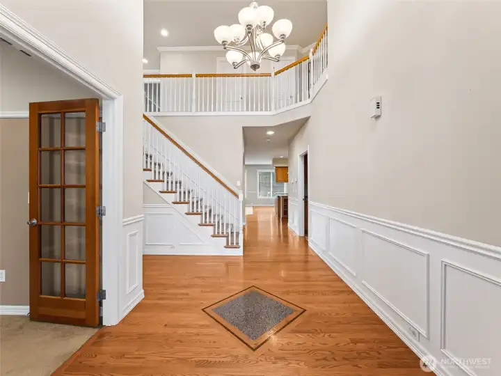 View from entry, cathedral ceiling, den to left (or 5th bedroom).
