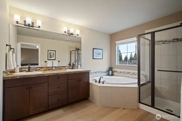 New French oak luxury wide plank flooring in all the bathrooms.