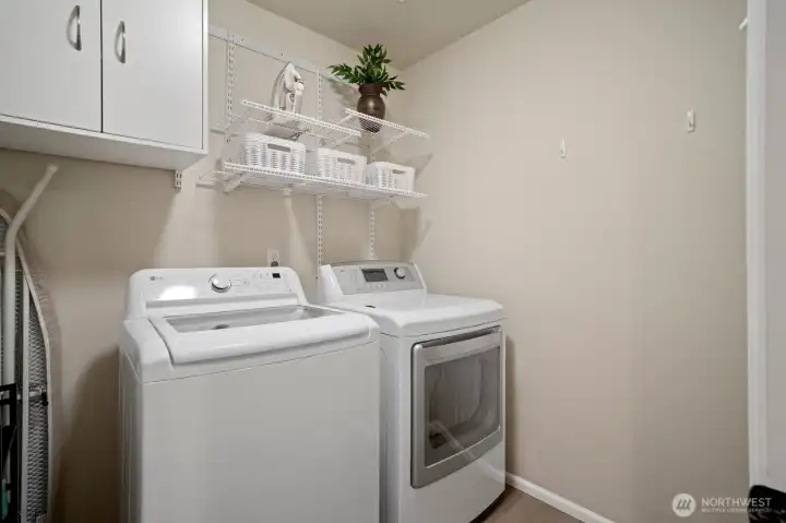 Laundry room on the upper level with a full sized washer & dryer.