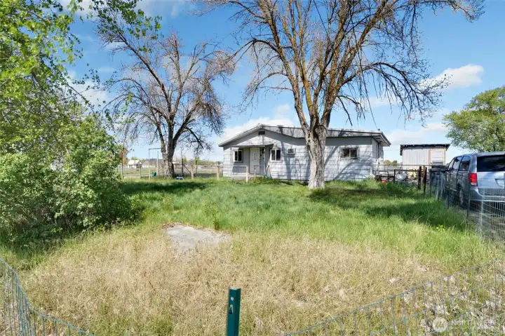 There's a fenced-in front yard for playing in.