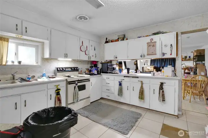 From the spacious kitchen, you see into the dining room and living room.