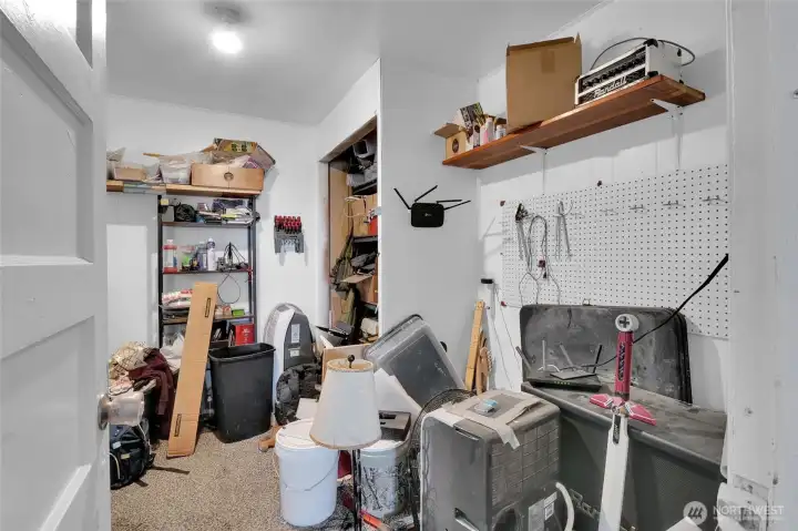 Bedroom 3 is being used as a storage room and workroom.