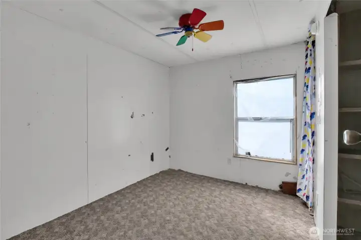 Middle bedroom of the single-wide trailer.