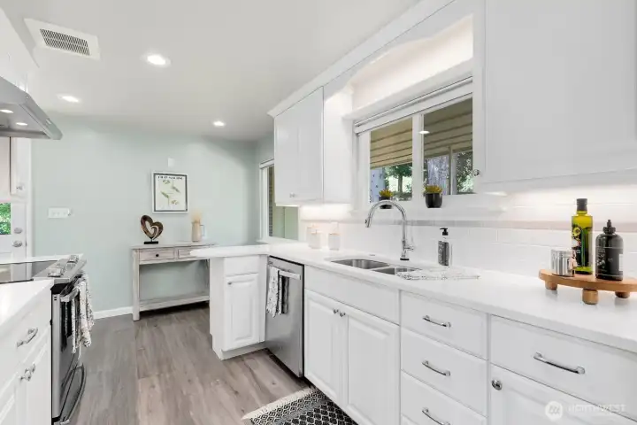 Sink with garden window views and generous counter space on both sides.